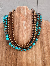 Load image into Gallery viewer, Turquoise Magnesite With Copper Hematite
